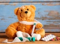 Cute stuffed teddy with a broken arm
