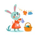 Cute stylised flat bunny rabbit mum hanging baby clothes. Cartoon isolated funny for design. Vector illustration. Royalty Free Stock Photo