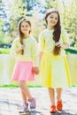 Cute stylish little girls posing at park outdoor Royalty Free Stock Photo