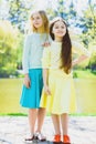 Cute stylish little girls posing at park outdoor Royalty Free Stock Photo