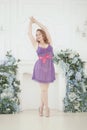 Pretty woman plus size in purple cute lingerie dress babydoll style on white studio room background alone. full length Royalty Free Stock Photo