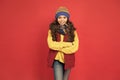Cute and stylish. Stylish girl red background. Little child with stylish look. Winter style. Fashion and style. Cute and