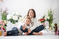 Cute stylish toddler child and older brother, boys with white shirt, playing with eggs and chocolate bunny on Easter decoration Royalty Free Stock Photo