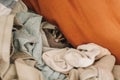 Cute Sugar Glider hiding in the pile of clothes and looking up cautiously.