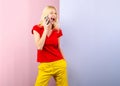 Cute surprised young woman chatting by mobile phone isolated background. Phone talking. Royalty Free Stock Photo