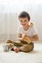 Cute sweet little child, preschool boy, playing with little chic Royalty Free Stock Photo