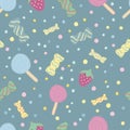 Cute sweets, candies, lollipops, vector seamless pattern on a blue background with colored sweets