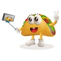 Cute taco mascot takes a selfie with smartphone