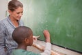 Cute teacher and a pupil making an addition Royalty Free Stock Photo