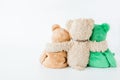 Friendship -three teddy bears holding in one`s arms Royalty Free Stock Photo