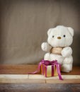 Cute Teddy Bear with Elegance Golden Gift Box for Jubilee Occasion Background Royalty Free Stock Photo