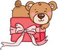 Cute teddy bear lying on gift box with ribbon bow