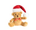 Cute teddy bear with red bowknot in Santa hat. Isolated on white background Royalty Free Stock Photo