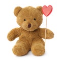 Cute teddy bear with red heart on background. Valentine`s day celebration Royalty Free Stock Photo