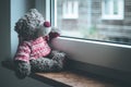 Leaving concept: Teddy bear is looking out of the window Royalty Free Stock Photo