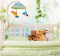 Cute Teddy bears in baby`s bed Royalty Free Stock Photo