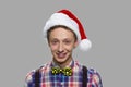 Cute teen boy in Christmas hat looking at camera. Royalty Free Stock Photo