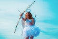 Cute teen cupid on the cloud - sky background. Lovely and cute youth. Lovely girl cupid with bow and arrow is ready to Royalty Free Stock Photo