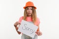 Cute teen girl character holding a sign with message sorry Royalty Free Stock Photo