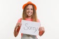 Cute teen girl character holding a sign with message sorry Royalty Free Stock Photo