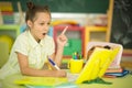 Portrait of cute teen girl doing homework in her room Royalty Free Stock Photo