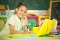 Portrait of cute teen girl doing homework in her room Royalty Free Stock Photo