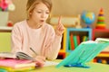 Portrait of cute teen girl doing homework in her room Royalty Free Stock Photo