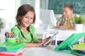 Cute teen girl doing homework in her room Royalty Free Stock Photo