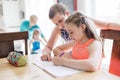 Cute teen girl doing homework at home Royalty Free Stock Photo