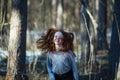 Cute teen girl posing in the pine park for a photo shoot Royalty Free Stock Photo