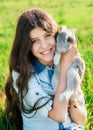 Cute teen girl with gray rabbit