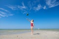 Cute teen girl playing and having fun with ball on beach at sunny summer day Royalty Free Stock Photo