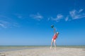 Cute teen girl playing and having fun with ball on beach at sunny summer day Royalty Free Stock Photo