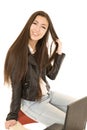 Cute teen girl sitting on the back of her school desk chair with Royalty Free Stock Photo