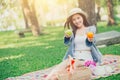 Cute teen giving fruit for eating healthy food when picnic Royalty Free Stock Photo