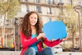 Cute teenage girl with blanked speech cloud