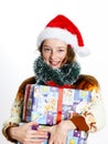 Cute teenage girl in santa red hat with gift box Royalty Free Stock Photo