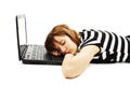 Cute teenage girl sleeping on her laptop computer Royalty Free Stock Photo