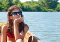 Cute teenage girl sunbathing on the boat Royalty Free Stock Photo