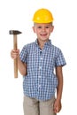 Cute teenager boy in blue checkered shirt and yellow building helmet, holding a hammer on white isolated background Royalty Free Stock Photo