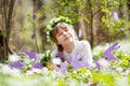 Cute teenager girl on Easter egg hunt in blooming spring garden. Children in snow drop flower meadow. Springtime in the garden Royalty Free Stock Photo