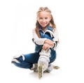 Cute teenager girl on rollerskates sitting