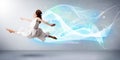 Cute teenager jumping with abstract blue scarf around her Royalty Free Stock Photo