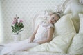 Cute tender girl teenager lies on the bed. Royalty Free Stock Photo