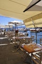 Terrace Restaurant design from Quay that lined the Sea Bay of Portofino City. Liguria region in Italy.