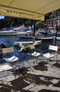 Terrace Restaurant design from Quay that lined the Sea Bay of Portofino City. Liguria region in Italy.