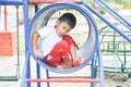 Cute Thai boy playing in tunnel