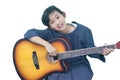 cute Thai girl happily plays the guitar