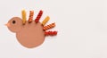 Cute Thanksgiving Turkey Craft for Kids with Macaroni Noodles Isolated with Copyspace