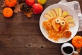 Cute Thanksgiving turkey pancakes, top view corner border against a rustic wood background Royalty Free Stock Photo